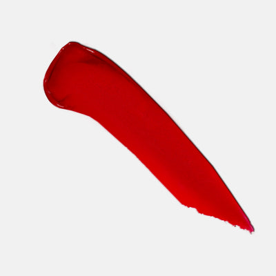 212 red lipstick color swatch closeup. Moisturizing, nourishing, hydrating, antioxidant-rich, and botanical-infused formula.