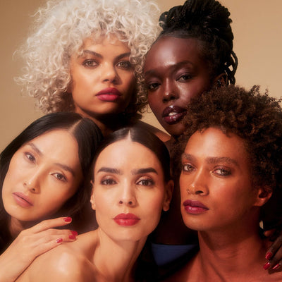 five male and female models posing together in a vintage inspired image highlighting emilie heathe lipsticks