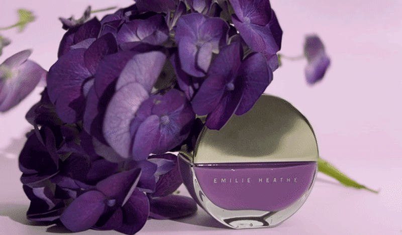 GIF flowers petals falling onto Aurora Nail Artist Nail Polish.