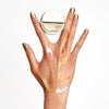 Billions Gold nail polish product shot creatively as paint. Long wearing, luxury, 10 free, non-toxic nail polish.