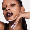 Emilie heathe the new vamp lipstick shot on dark skinned model with bleached eyebrows