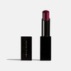 The New Vamp deep plum lipstick product shot. Moisturizing, nourishing, hydrating, antioxidant-rich, and botanical-infused formula.