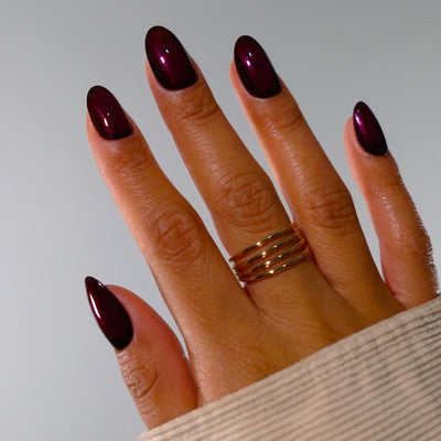Vengeance garnet red nail polish product shot on white background. Long wearing, luxury, 10 free, non-toxic nail polish.